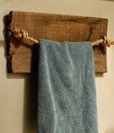 a blue towel hanging from a wooden hook