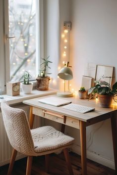 a desk with a computer and some plants on it in front of a large window