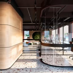 an empty office with glass walls and chairs