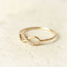 an image of a gold ring with diamonds on the bottom and in the middle that says best seller holiday sale