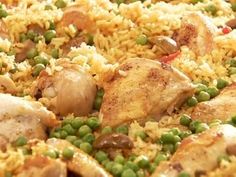 chicken and rice with peas in a skillet