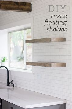 a white counter top sitting under a window next to a kitchen faucet and sink