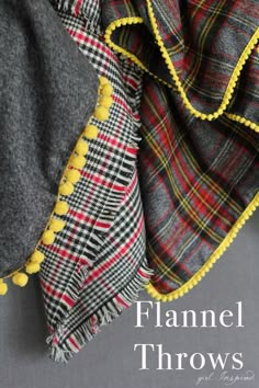 a plaid blanket with pom poms hanging from it's sides and the words flannel throws written below