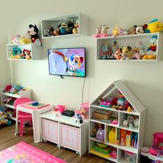 a child's room with toys and stuffed animals on the wall