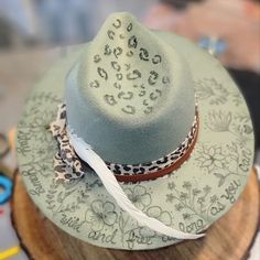 This Would Be A Beautiful Staple For Any Fall Outfit. I Make These Custom Wood Burned Hats. Every Hat Is Original And Unique To Itself. I Can Many Different Designs And I Have Several Different Color Hats Available. This One Is A Mix Of Floral And Leopard Print On A Sage Green Felt Hat. There's Still Room For More Customization!! Burned Hats, Custom Cowboy Hats, 2 Broke Girls, Painted Hats, Boho Hat, Unique Hats, Diy Hat, Crafts For Girls, Cute Hats