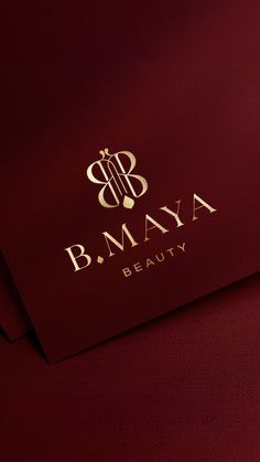 the b maya beauty logo is on top of two red envelopes with gold foil lettering