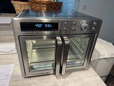 an oven with the door open sitting on a counter