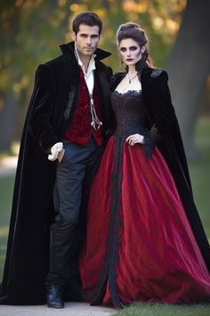 a man and woman dressed in period costumes