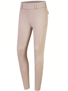 a woman's riding pants in beige