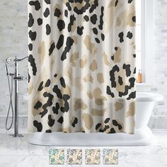 the shower curtain is decorated with black and white animal print