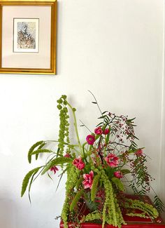 Organic, explosive flower arrangement. This flower arrangement was created in a cement vase using chicken wire. The base of the arrangement features peppercorn berries and highlights movement and height through the use ofamaranthus, wheat, tulips and ranunculus. The arrangement is high end, editorial and chic. It combines many elements to highlight movement and organic feel. Amaranthus Arrangement, Flowing Aesthetic, Living Room Flowers, Organic Composition, Luxury Flower Arrangement, Room Flowers, Cement Vase, Flowers Luxury