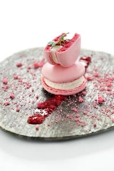 a plate with some food on it that is covered in pink and red sprinkles