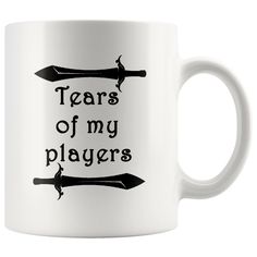 a white coffee mug with the words tears of my players on it and two swords