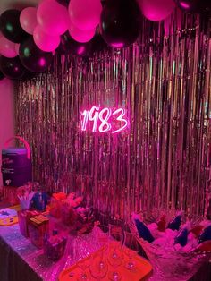 an image of a party with balloons and streamers on the wall in the background