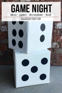 two white boxes with black polka dots on them and the words game night written above it