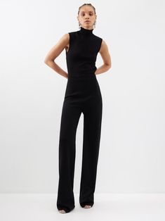 Cut with an alluring backless silhouette, GAUGE81's black jersey Gijon jumpsuit has a sleeveless high-neck construction and falls into figure-skimming wide legs. Sleeveless Jumpsuit Outfit, High Neck Jumpsuit, Leather Sweater, Fit Board, Jumpsuit Outfits, Capsule Wardrobe Ideas, Jersey Jumpsuit, Outfits Dressy, Formal Jumpsuit