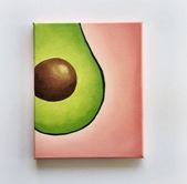 an avocado painted on a pink and green square