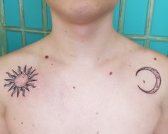 a man's chest with a sun and moon tattoo on the left side of his chest