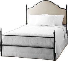 a bed with white sheets and pillows on it's headboard, in front of a white background