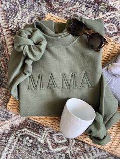 Minimalist Mama Sweatshirt Pictured: Army with Dark Sage thread  Make a big announcement or wear this minimalist design with style! Key Features: Soft and comfortable fabric for daily wear Versatile style for any occasion Available in various color and sizes A meaningful gift for a new mom or seasoned toddler mom Minimalist Mama, Mama And Mini, Trendy Mom, Toddler Mom, Sweatshirt Set, Mama Sweatshirt, Shirt Embroidery, Mom Sweatshirt, Embroidered Sweatshirt