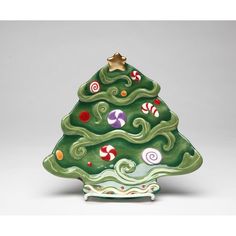 a ceramic christmas tree with candy canes on it