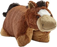 the stuffed horse is laying down on its back and it's head turned towards the camera