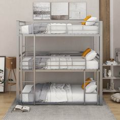 a bunk bed with two sets of mattresses on top of it in a room