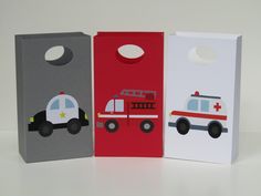 three bags with firetrucks on them sitting next to each other in front of a white background