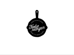 a black and white photo of a frying pan with the words foodie waffleman on it