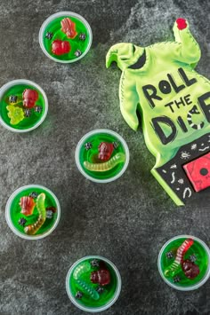 small plastic cups filled with green and red items