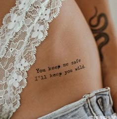 the back of a woman's stomach with an inscription on it that reads, you keep me safe i'll keep you wild