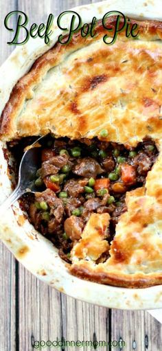 beef pot pie is shown with a spoon in it