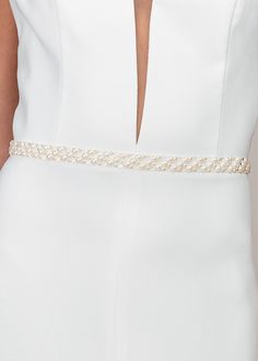 The ISABELLA sash has become one of our best sellers and will add some romance to your bridal look. Made with a mixture of pearls and see-through clear crystals to add a subtle touch of sparkle, this glamorous wedding belt will not disappoint. The pearls and crystals are hand-applied to a soft organza ribbon to blend in with your wedding gown. This accessory is available in bright white or trendy ivory. The belt measures 72 inches long, and the ribbon can tie in the back making the piece one siz Pearl Bridal Belt, Waist Belt Pearl, Luxury Designer White Belt, Pearl Wedding Dress Belt, Wedding Pearl Beaded Bridal Belt, Elegant Pearl Embellished Bridal Belt, Bridal Belts, Classic Pearl Necklace, Wedding Belt