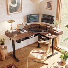 a corner desk with a computer on it in front of a window and potted plants