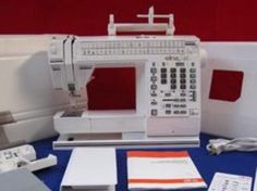 a sewing machine sitting on top of a blue table