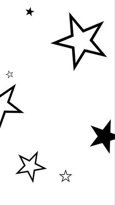 black and white stars are flying in the air with one star at the top right