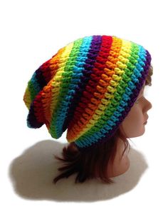 a multicolored knitted hat on top of a mannequin head