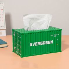 a green container sitting on top of a wooden table