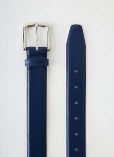 This classic men’s leather belt is made of 100% genuine leather and will elevate any pant with its sleek and timeless look. Available in black, brown, and ultramarine blue this belt will be the newest addition to your 12 Mo’er collection. 100% Cow Leather Style Number: AF22MB0174 Available in: Black, Brown, Ultramarine Blue, White Modern Bridle Leather Belt For Business, Luxury Blue Leather Belt, Luxury Blue Belt For Formal Occasions, Luxury Blue Formal Belt, Blue Leather Belt Buckles With Removable Belt, Elegant Blue Leather Belt, Ultramarine Blue, Leather Belts Men, Leather Style