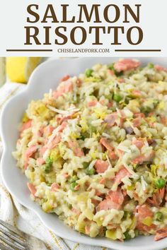 a white bowl filled with coleslaw and salmon risotto on top of a table