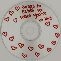 a cd with hearts and words on it that says, songs to listen to when you're i'm love