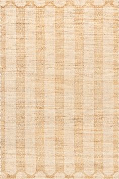 an area rug with beige and white stripes