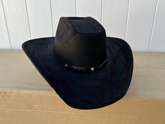 Unisex adult size western hat. Black western hat. The color and design of the hat band may vary. Hat has an elastic band on the inside for a comfortable fit. medium fit = 7 and 7 1/8 large fits = 7 1/4 and 7 3/8 Western Style Adjustable Black Hat, Luxury Black Cowboy Hat For Rodeo, Western Hat Black Or Brown, Western Black Hat One Size, Black Cowboy Hat For Ranch, Cowboy Rodeo, Western Hat, Western Hats, 7 And 7