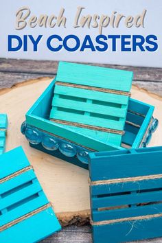 blue wooden crates sitting on top of a piece of wood with text overlay reading beach inspired diy coasters