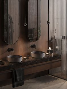 a bathroom with two sinks and mirrors in the wall next to each other on top of a counter