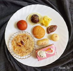 a white plate topped with different types of food