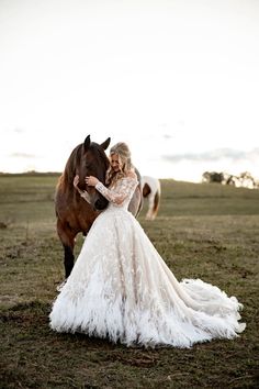 a woman in a wedding dress standing next to a horse