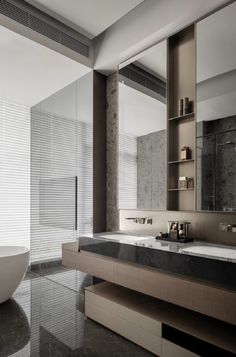 a large bathroom with two sinks and a bathtub