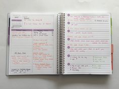 an open planner book with writing on it