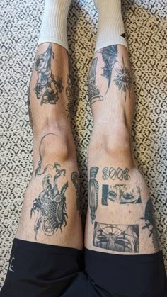 the legs and ankles of a man with tattoos